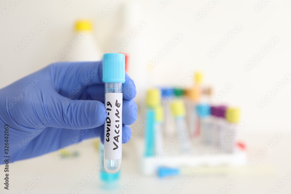 coronavirus flu - test tube with vaccine in medical biotechnology laboratory