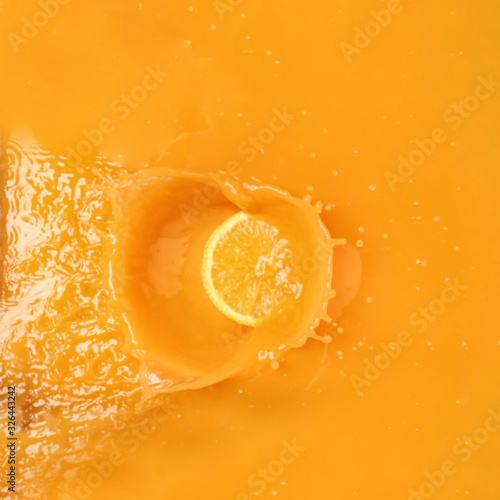 Delicious orange slice in juice, top view