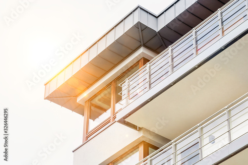 Low angle view of balcony of rental aparment business © moodboard