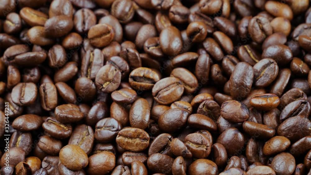 Roasted coffee beans with smoke in a pan Roasted coffee beans with smoke in a pan