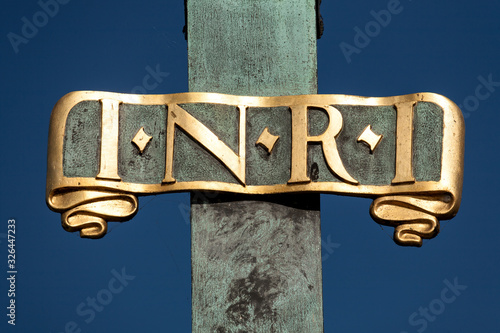 Sign I N R I (Iesus Nazarenus Rex Iudaeorum) on a religious sculpture on Charles Bridge in Prague, Czech Republic photo