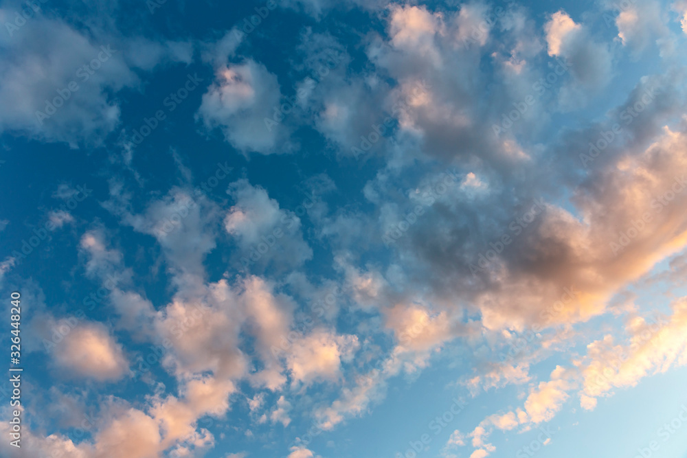 Beautiful evening blue sky with golden clouds as a natural background Beautiful evening blue sky with golden clouds as a natural background