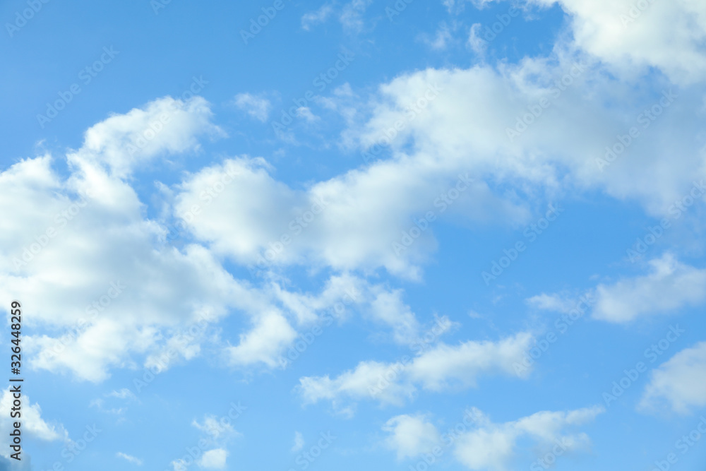 Picturesque view of beautiful blue sky with fluffy white clouds Picturesque view of beautiful blue sky with fluffy white clouds