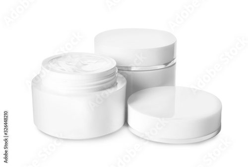 Jars of luxury face creams isolated on white