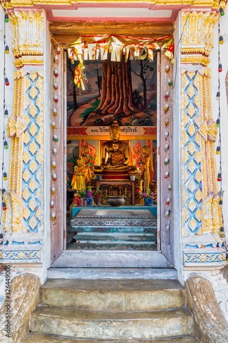 Amphawa District, Samut Songkhram / Thailand / February 23, 2020 : Wat Mueang Mai. The temple is located on the waterfront. With a peaceful atmosphere. The old church remains to be seen.. photo