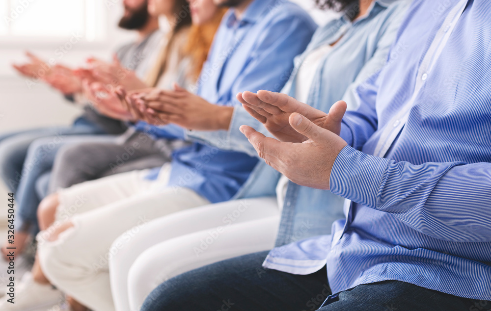 Therapy Session Members Sitting In A Row And Applauding To Speaker