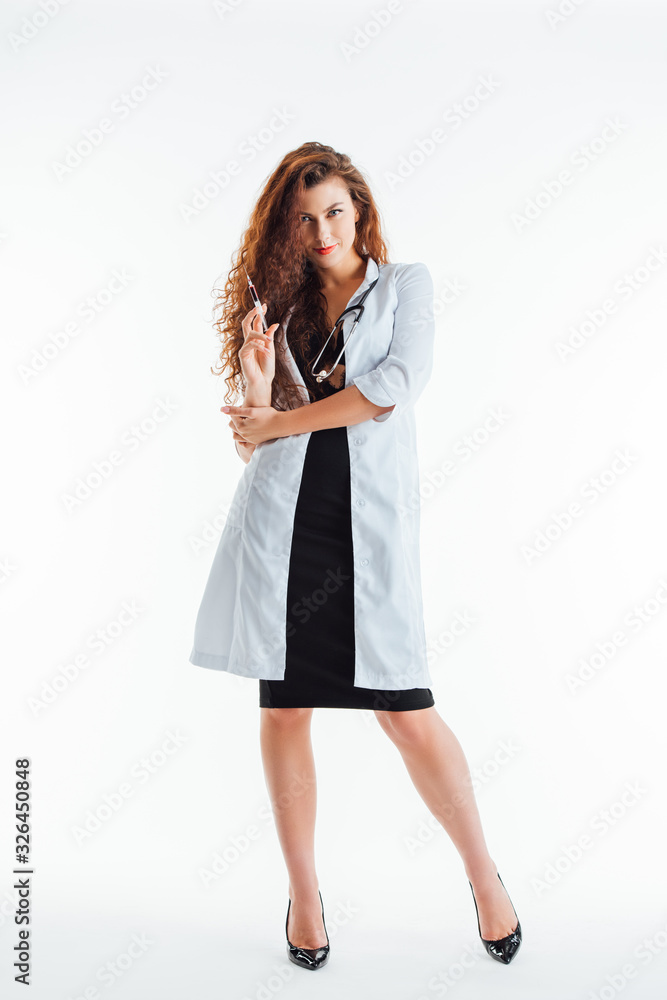 curly and sexy nurse holding syringe while standing on white curly and sexy nurse holding syringe while standing on white