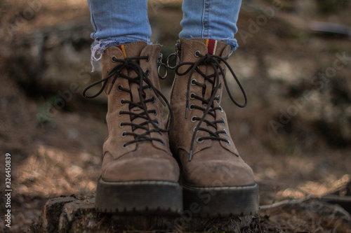 Close-up of a girl's boots in the field