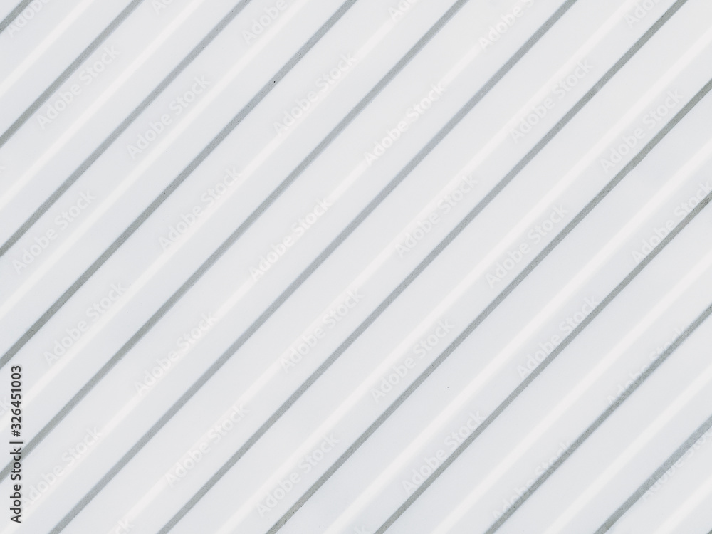Fototapeta premium Parallel grooves are located diagonally on a white background.