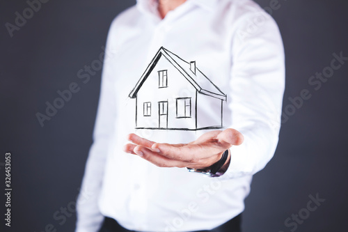 man hand house model in screen