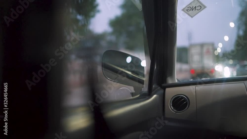 from inside the car with reflections and at night in india