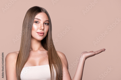 A beautiful woman presents an advertisement product