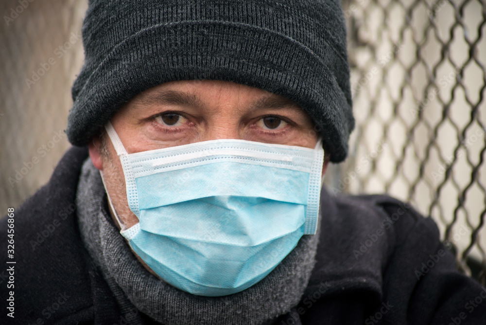 Portrait of man with medical mask to protect against the corona virus in the street Portrait of man with medical mask to protect against the corona virus in the street