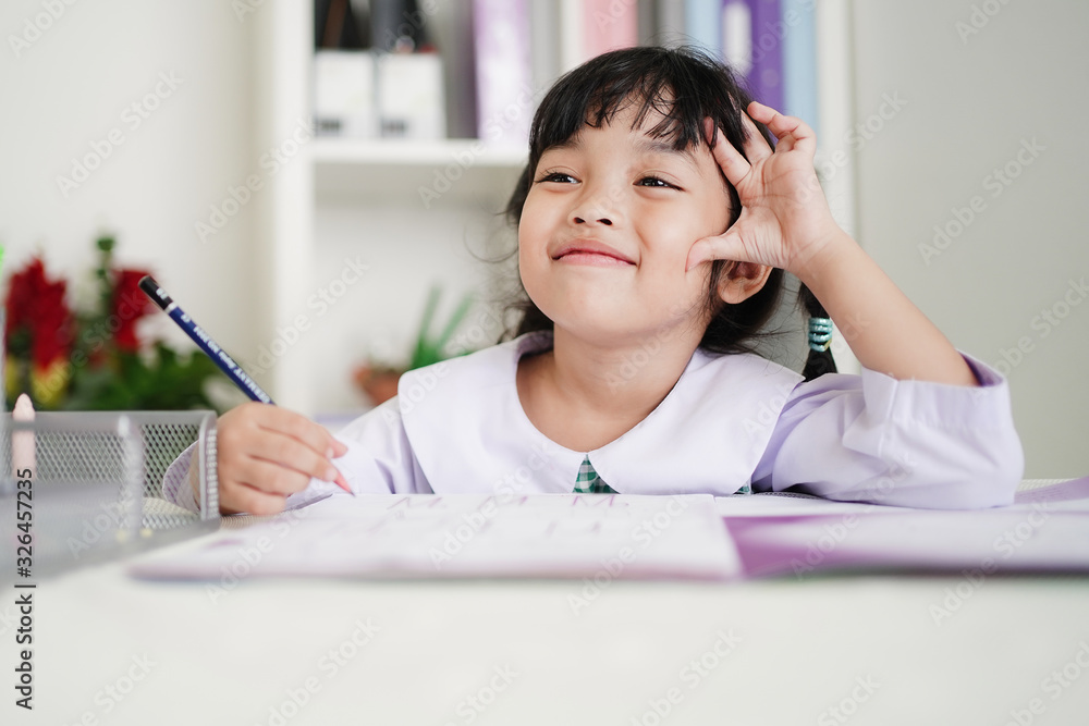 Happy genuis student kid girl enjoy learning at school. Intelligence,Hoework, studying and Education concept. Happy genuis student kid girl enjoy learning at school. Intelligence,Hoework, studying and Education concept.