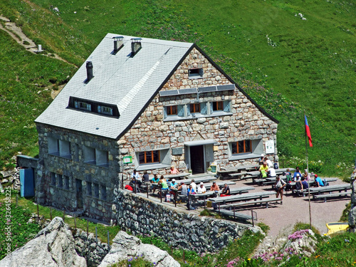 The mountain hut Pfälzerhütte (Pfaelzerhuette or Pfalzerhutte) in the Naaftal Valley and in the Liechtenstein Alps mountain massiv (Berghütte Pfälzerhütte auf dem Bettlerjoch) - Malbun, Liechtenstein photo