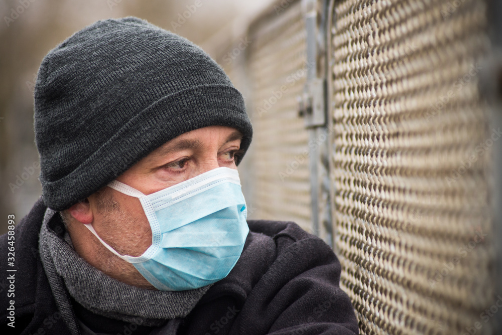Portrait of man with medical mask to protect against the corona virus in the street Portrait of man with medical mask to protect against the corona virus in the street