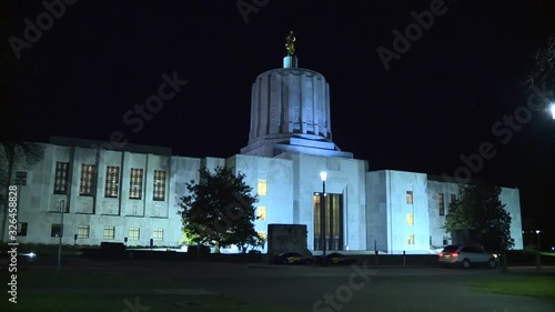 OUTSIDE THE OREGON STATE CAPITOL BUILDING AT NIGHT IN SALEM OREGON photo