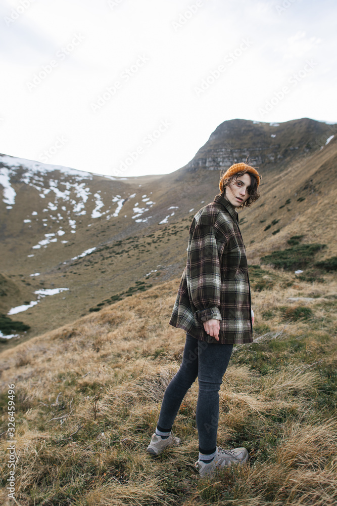 young woman in autumn mountains, feel freedom