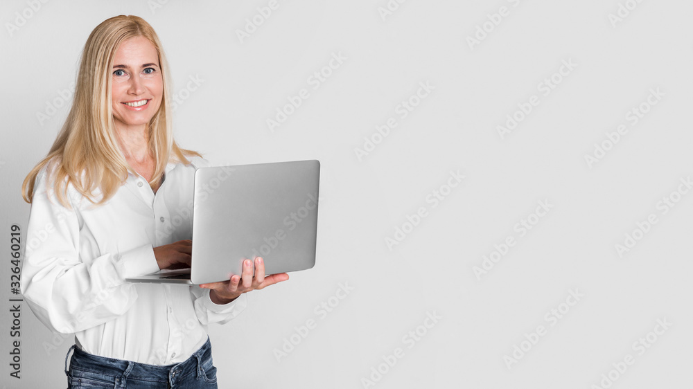Confident Mature Woman Smiling At Camera At Studio Confident Mature Woman Smiling At Camera At Studio