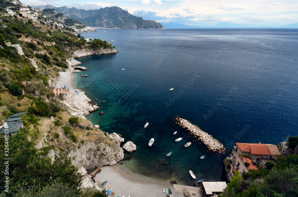 Panorama of the coast towards Amalfi.. Marina di Conca is a small bay surrounded by numerous white houses and represents the main bathing establishment of the village. Amalfi coast, Italy