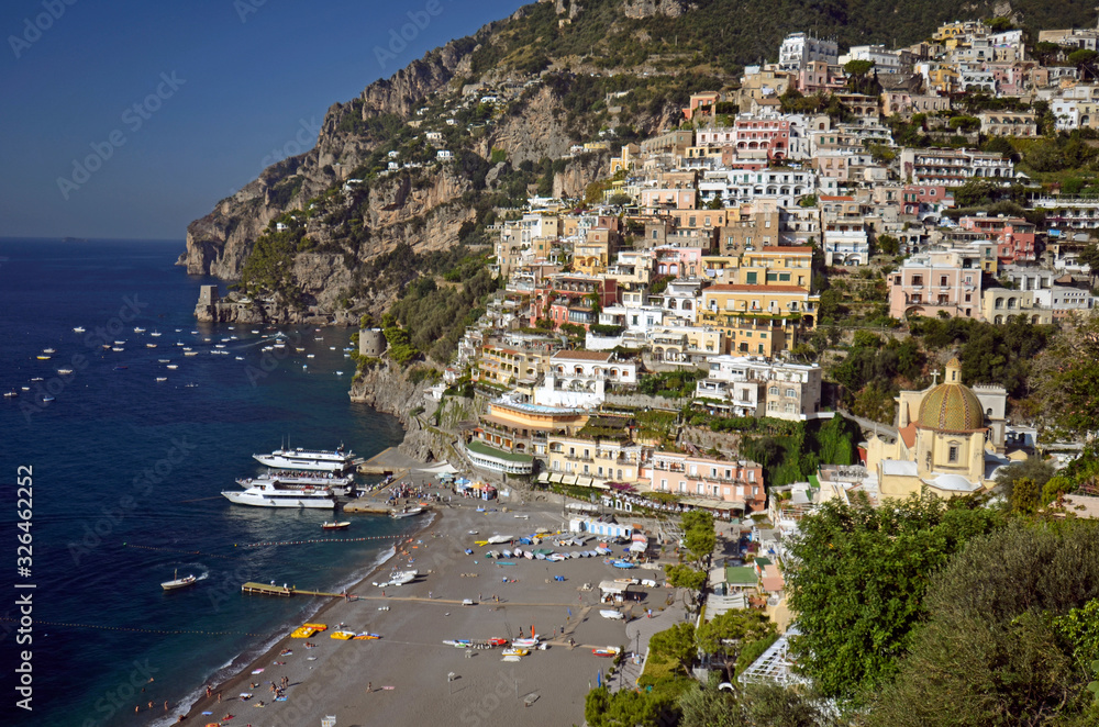 Positano. View from above of the large beach and the village that climbs the hill