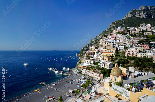 Positano. View from above of the large beach and the village that climbs the hill photo