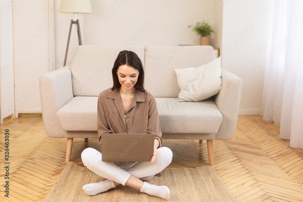 Young woman working at home on the floor Young woman working at home on the floor