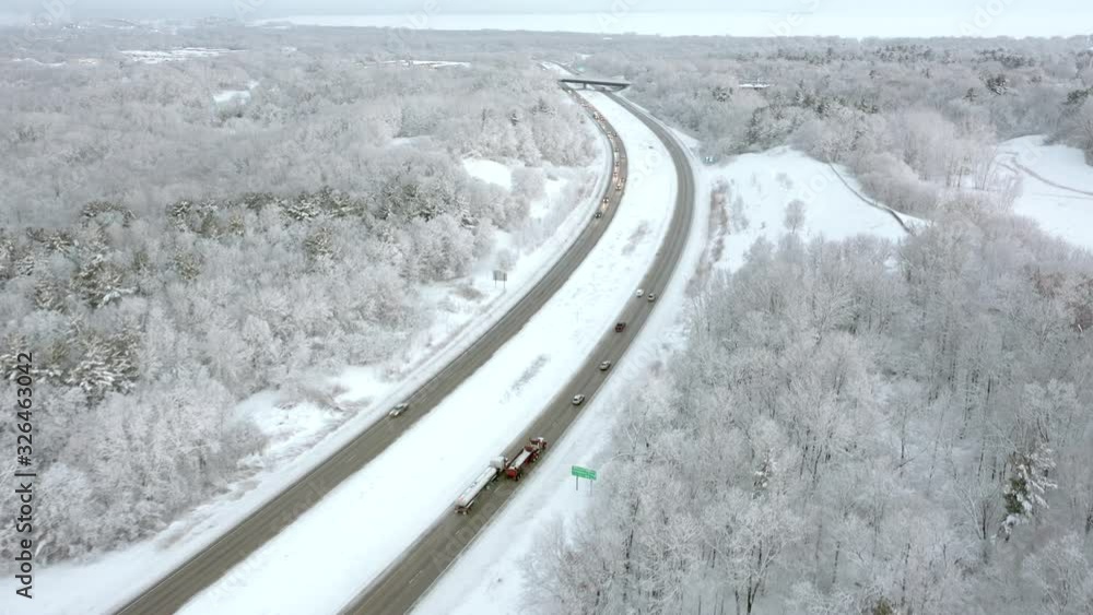 Winter, snowy weather traffic, morning commute on busy highway. Winter, snowy weather traffic, morning commute on busy highway.