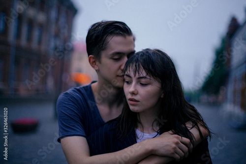 Hugging loving boy and girl outside