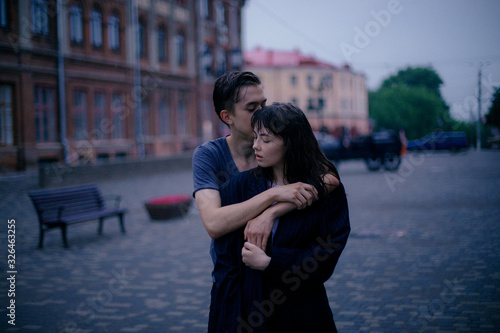 Hugging loving boy and girl outside