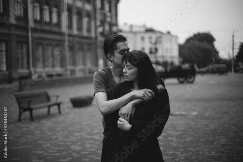 Hugging loving boy and girl outside