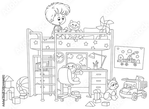 Happy small kid with toys in his nursery room with a funny bed and a table with a computer and a lamp, black and white vector cartoon illustration for a coloring book page