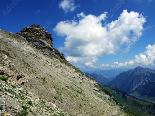 Rocks and stones of the Liechtenstein Alps mountain massiv and over the Naaftal alpine valley - Malbun, Liechtenstein photo