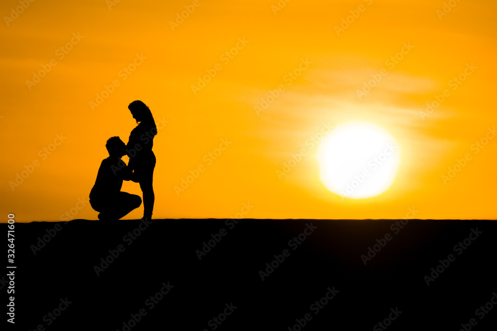 Couple silhouette giving love each other