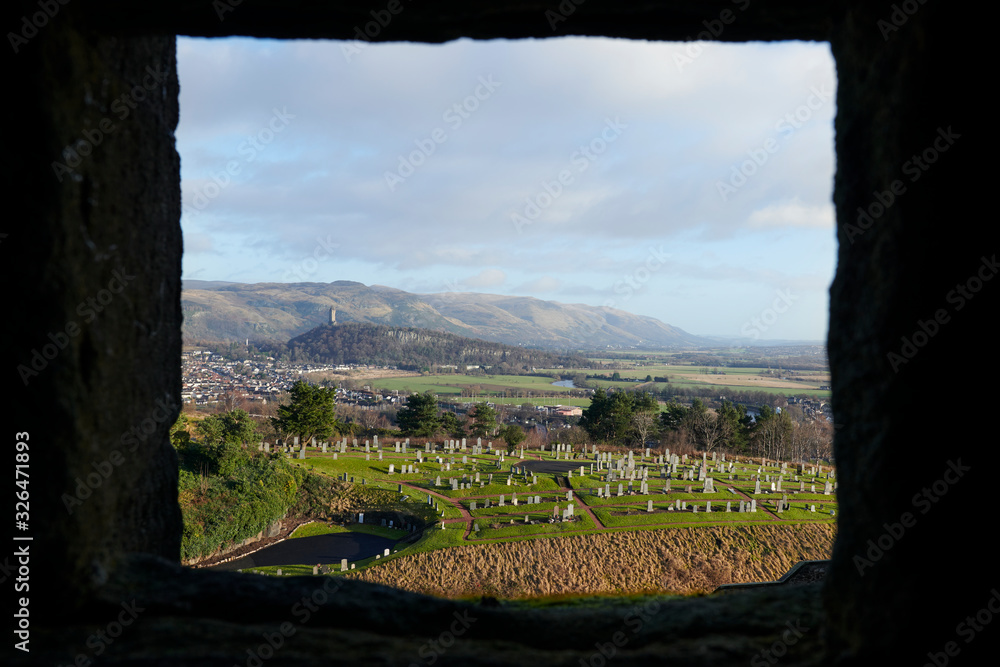 Obraz premium Landscape from Stirling Castle. In the background the monument to William Wallace and a cemetery. Edinburgh, Scotland, UK. 1-3-2019