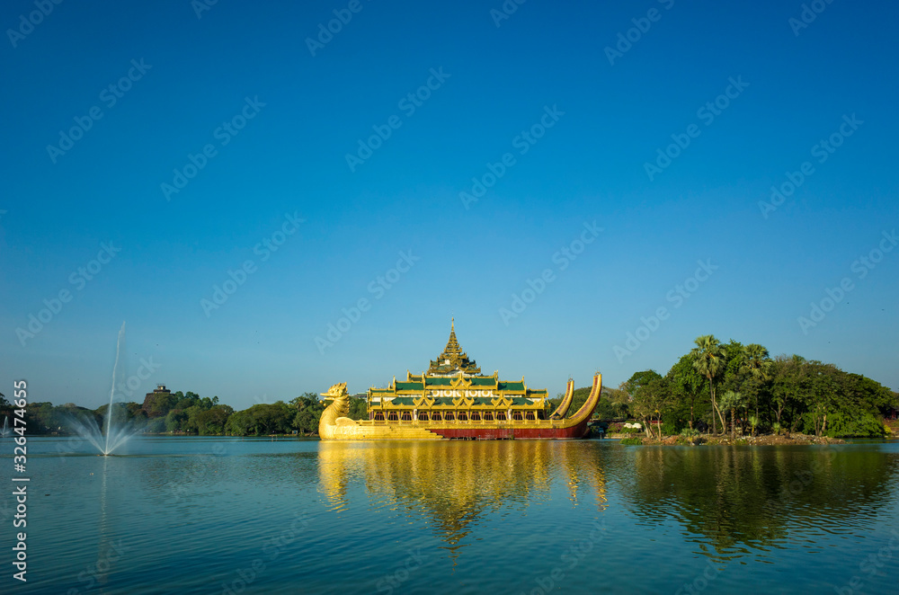 Burmese royal barge Golden Karaweik palace on Kandawgyi Lake in Bogyoke Park in Yangon, Myanmar Burmese royal barge Golden Karaweik palace on Kandawgyi Lake in Bogyoke Park in Yangon, Myanmar