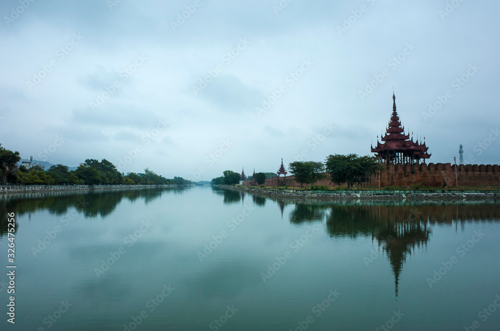 Fototapeta premium Mandalay Palace wall and moat under grey sky, Myanmar