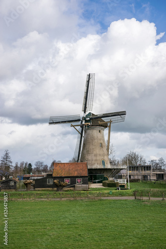 Scenic view of windmill "Haastrechtse Molen" in the city of Gouda, Holland.