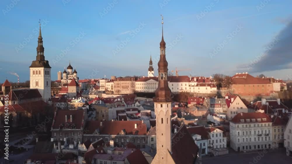 Aerial view of Tallinn old city. Estonian capital from drone. Beautiful medieval city. Golden hour sunrise reveal shot. European architecture. Aerial view of Tallinn old city. Estonian capital from drone. Beautiful medieval city. Golden hour sunrise reveal shot. European architecture.