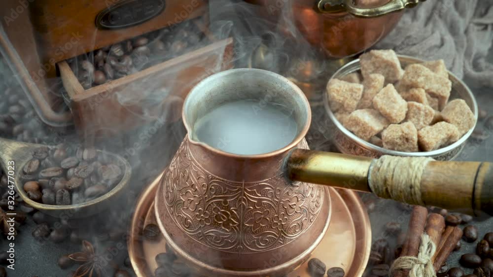 Hot black coffee in a coffee maker with a smoke Hot black coffee in a coffee maker with a smoke
