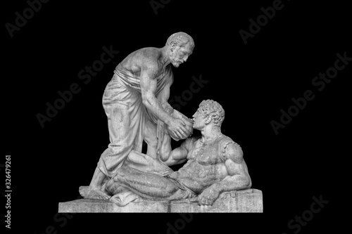 Fototapeta Old age and youth - a monument on a black background.