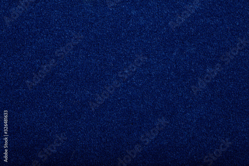 Carpet covering background. Pattern and texture of blue colour carpet. Copy space