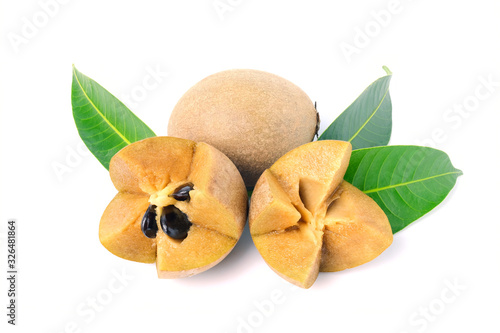 sapodilla fruit with green leaves isolated on the white background photo