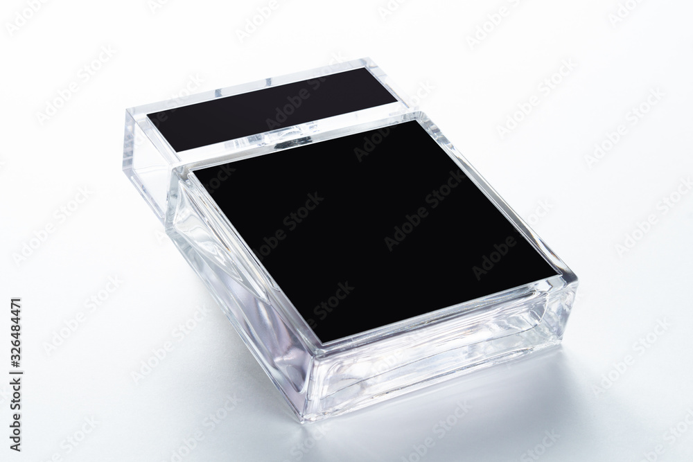 glass container with perfume and black label, bottle with liquid glass container with perfume and black label, bottle with liquid