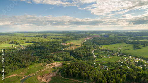 a city surrounded by a forest from a bird 's eye view