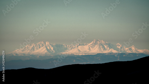 Fototapeta Naklejka Na Ścianę i Meble -  Temperature inversion in the mountains. The Tatra Mountains seen from the Bieszczady. Carpathians. Poland