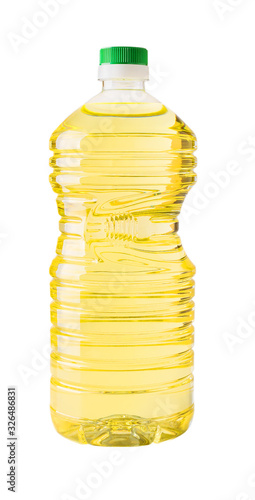 Cooking sunflower or vegetable oil in a 2l transparent plastic bottle with green cap  isolated on white background. Large container with recess for hand.
