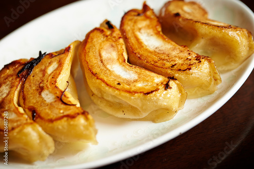 Wallpaper Mural Pan fried dumpling on white plate Torontodigital.ca