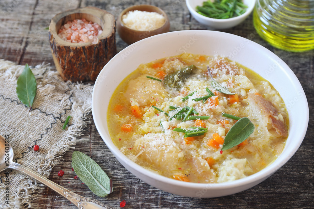 Italian food. Pancotto: bread soup with grated Parmesan cheese Italian food. Pancotto: bread soup with grated Parmesan cheese