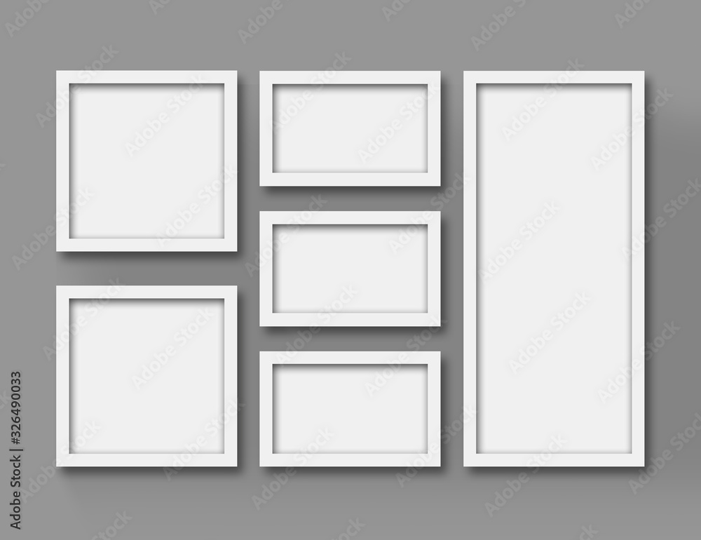 Modern frame set on the wall. Isolated blank frames. Embossed picture frames with realistic shadows.